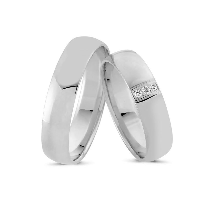 Unikke Nuran vielsesringe i 14 kt hvidguld med 0,03 ct diamanter, buet profil og klassisk design.